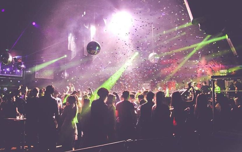Image may contain: Crowd, Disco, Lighting, Club, Night Club, Person, Human