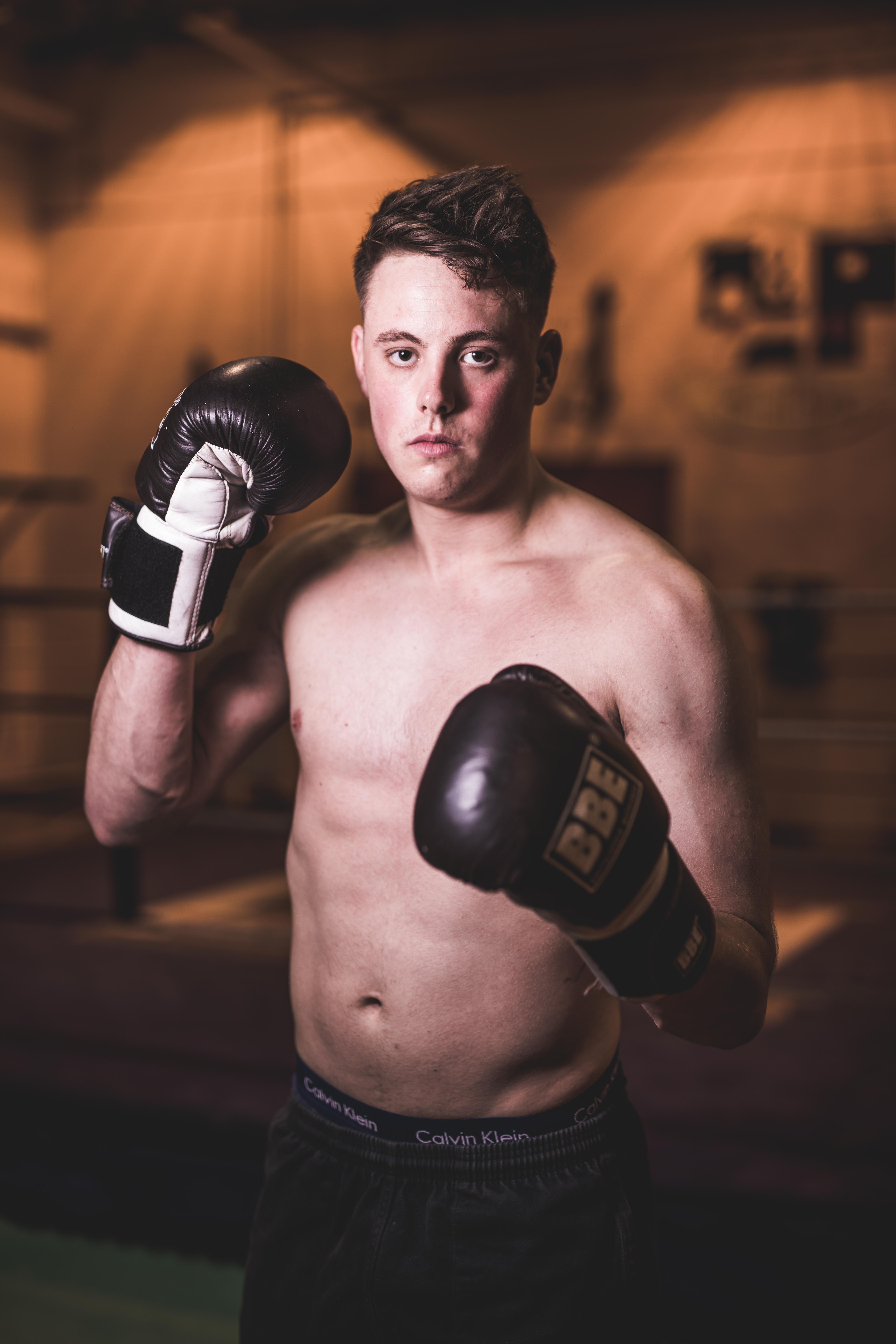 Image may contain: Sport, Boxing, Sports, Microphone, Electrical Device, Person, Human