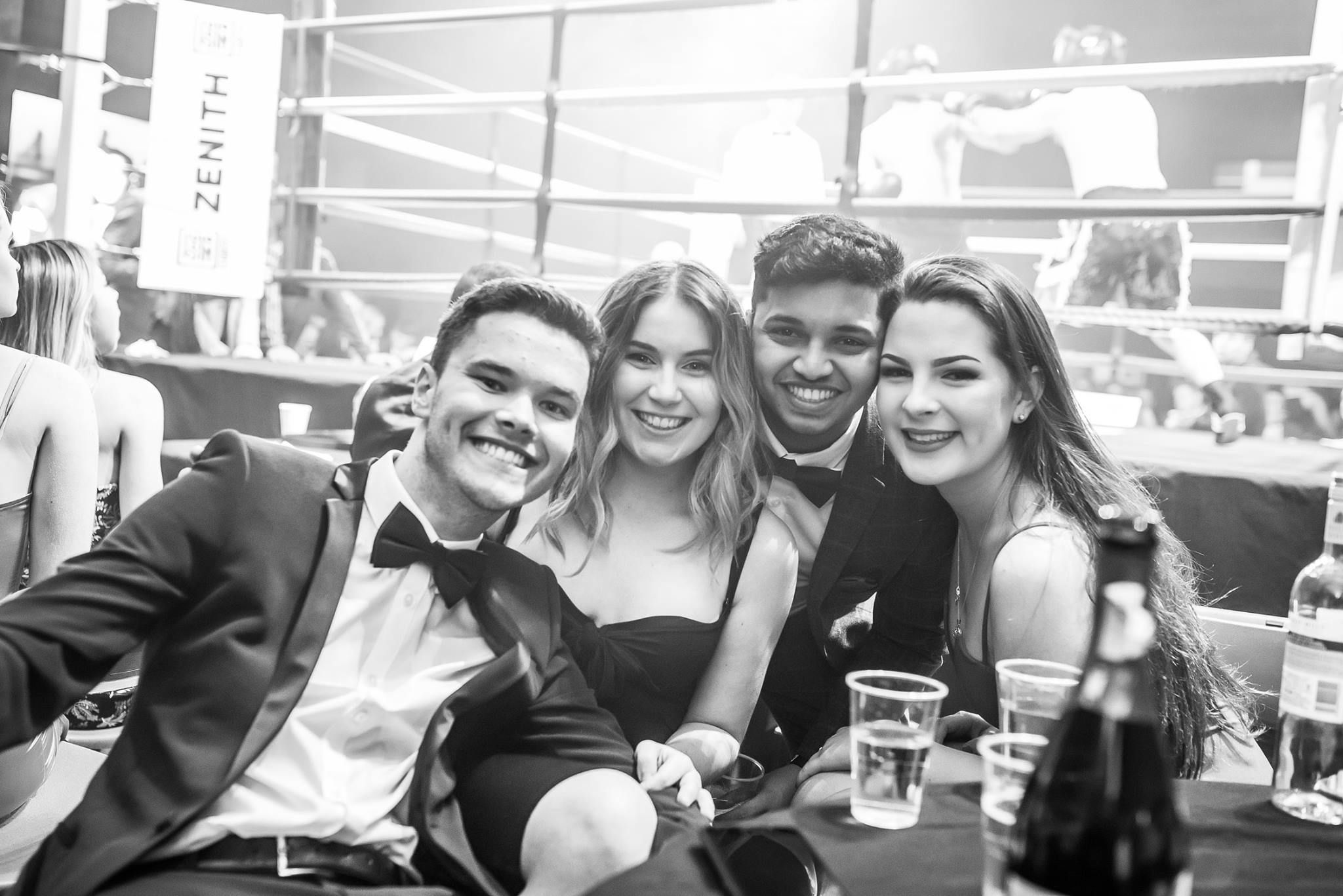 Image may contain: Alcohol, Beer, Tuxedo, Glass, Portrait, Photo, Photography, Dating, Female, Beverage, Drink, Coat, Overcoat, Suit, Smile, Apparel, Clothing, Face, Person, Human