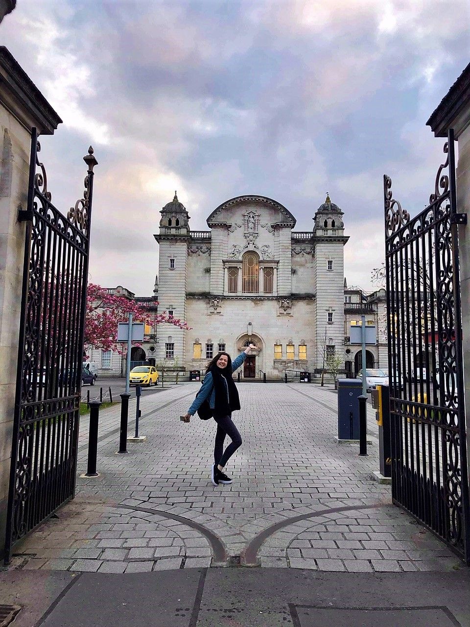 Image may contain: Architecture, Building, Flagstone, Gate, Sidewalk, Pavement, Pedestrian, Railing, Human, Person, Path, Walkway