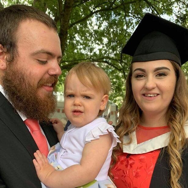 Image may contain: Portrait, Photo, Photography, Blazer, Jacket, Smile, Outdoors, Man, Graduation, Plant, Tree, Overcoat, Suit, Coat, Hug, Woman, Child, Kid, Girl, Blonde, Teen, Dress, Apparel, Clothing, Face, Female, Human, Person