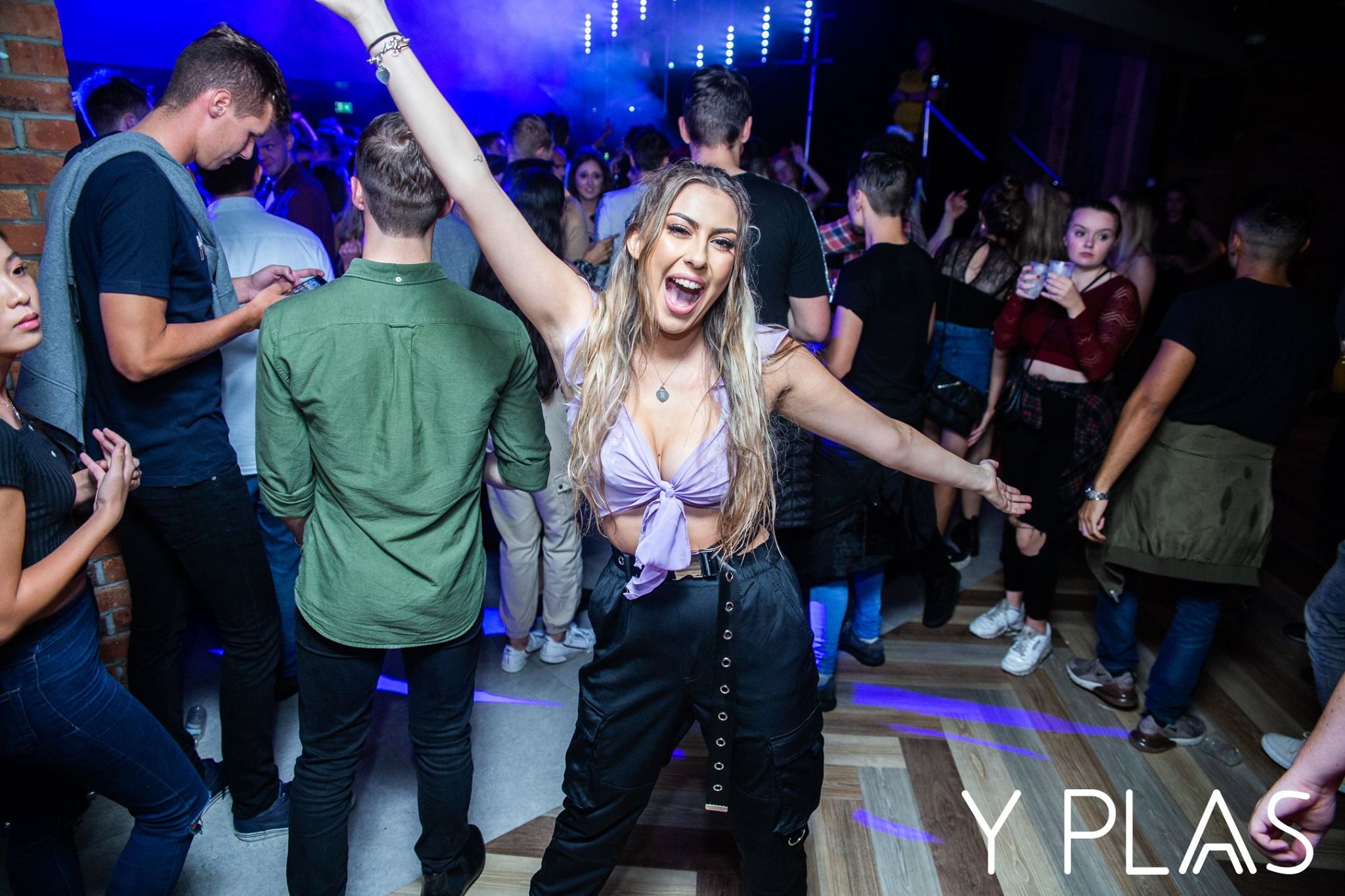 Image may contain: Disco, Night Life, Party, Night Club, Club, Clothing, Footwear, Shoe, Apparel, Human, Person