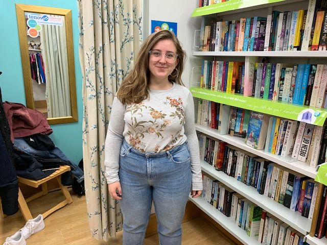 Image may contain: Bookcase, Shelf, Girl, Female, Jeans, Denim, Book, Library, Furniture, Pants, Clothing, Apparel, Room, Indoors, Person, Human