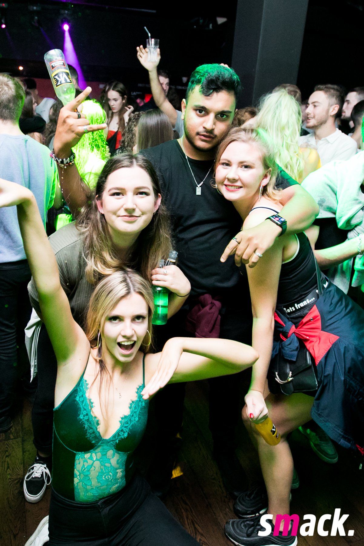 Image may contain: Club, Clothing, Footwear, Shoe, Apparel, Crowd, Party, Night Life, Person, Human
