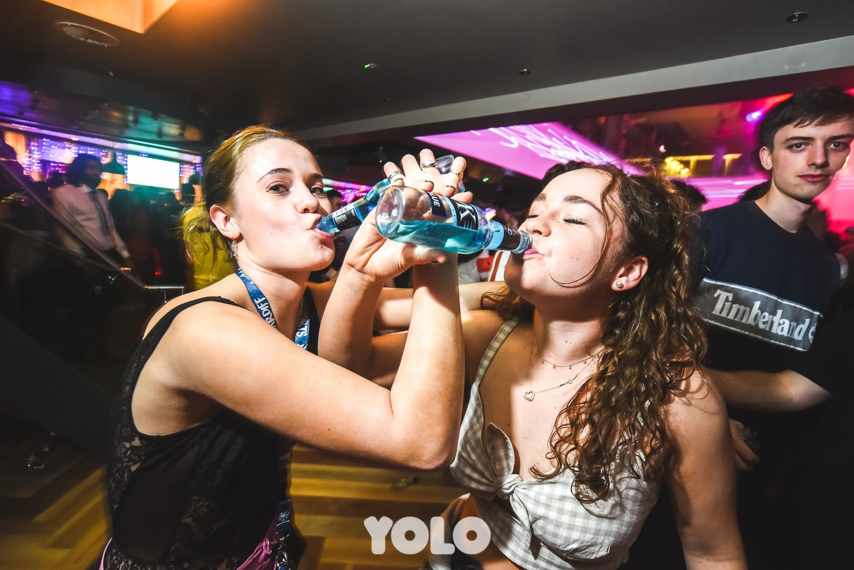 Image may contain: Drink, Beverage, Clothing, Apparel, Lighting, Night Club, Club, Party, Night Life, Person, Human
