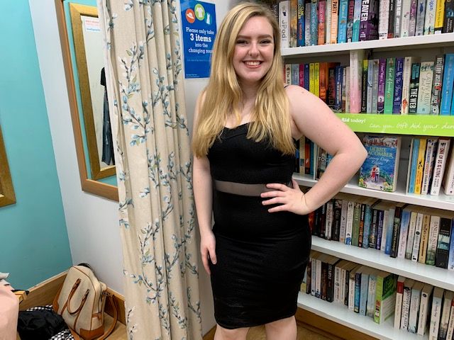 Image may contain: Interior Design, Library, Bookcase, Female, Shelf, Furniture, Apparel, Clothing, Room, Indoors, Human, Person, Book