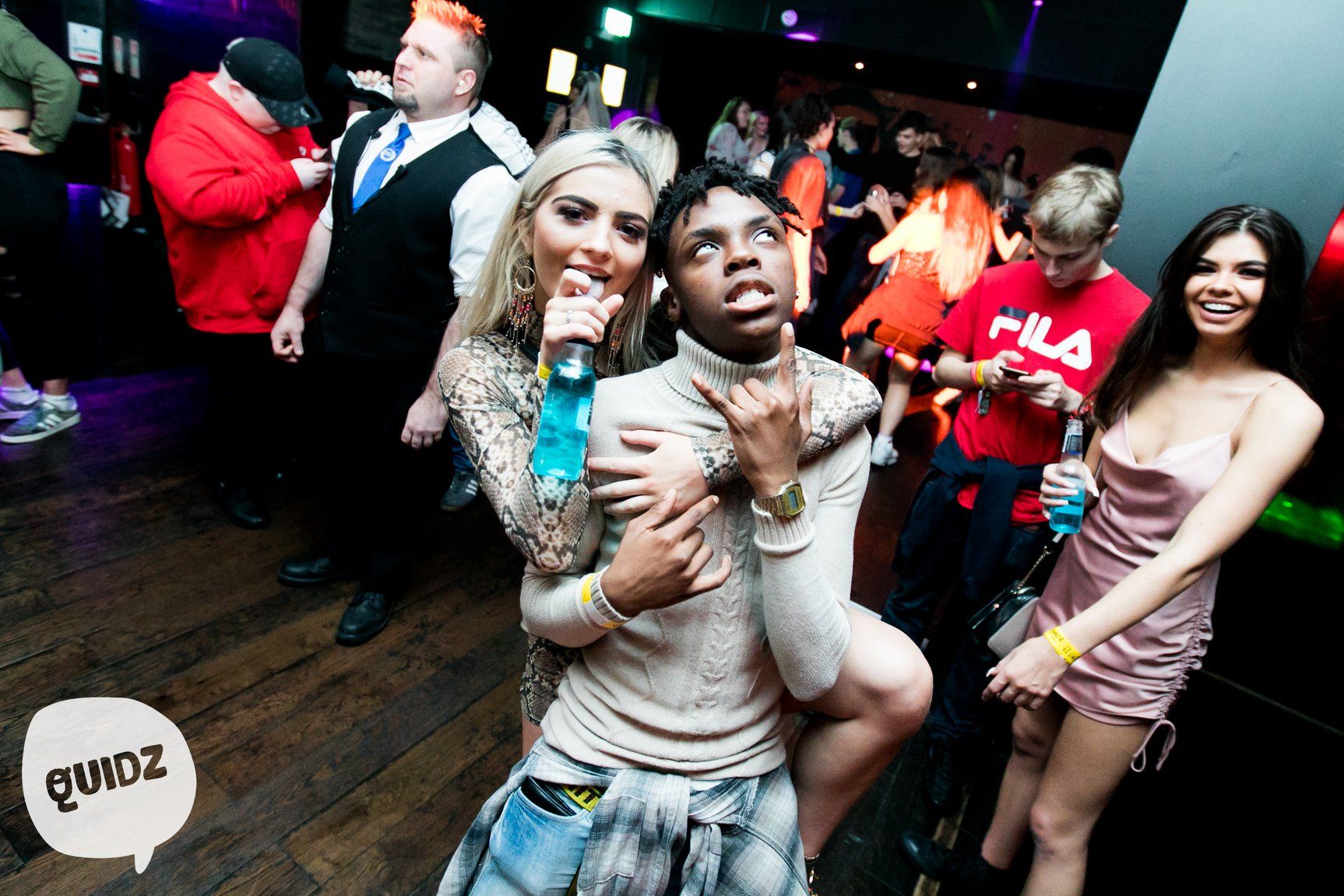 Image may contain: Party, Night Club, Night Life, Shoe, Footwear, Apparel, Clothing, Crowd, Audience, Club, Human, Person