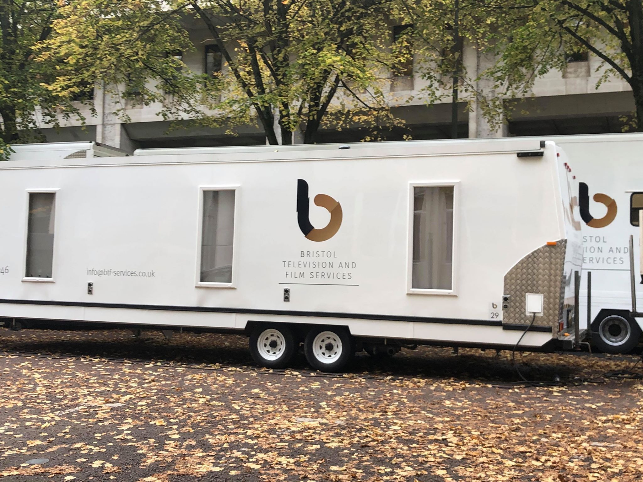 Image may contain: Van, Machine, Wheel, Truck, Vehicle, Transportation, Mobile Home, Building, Housing