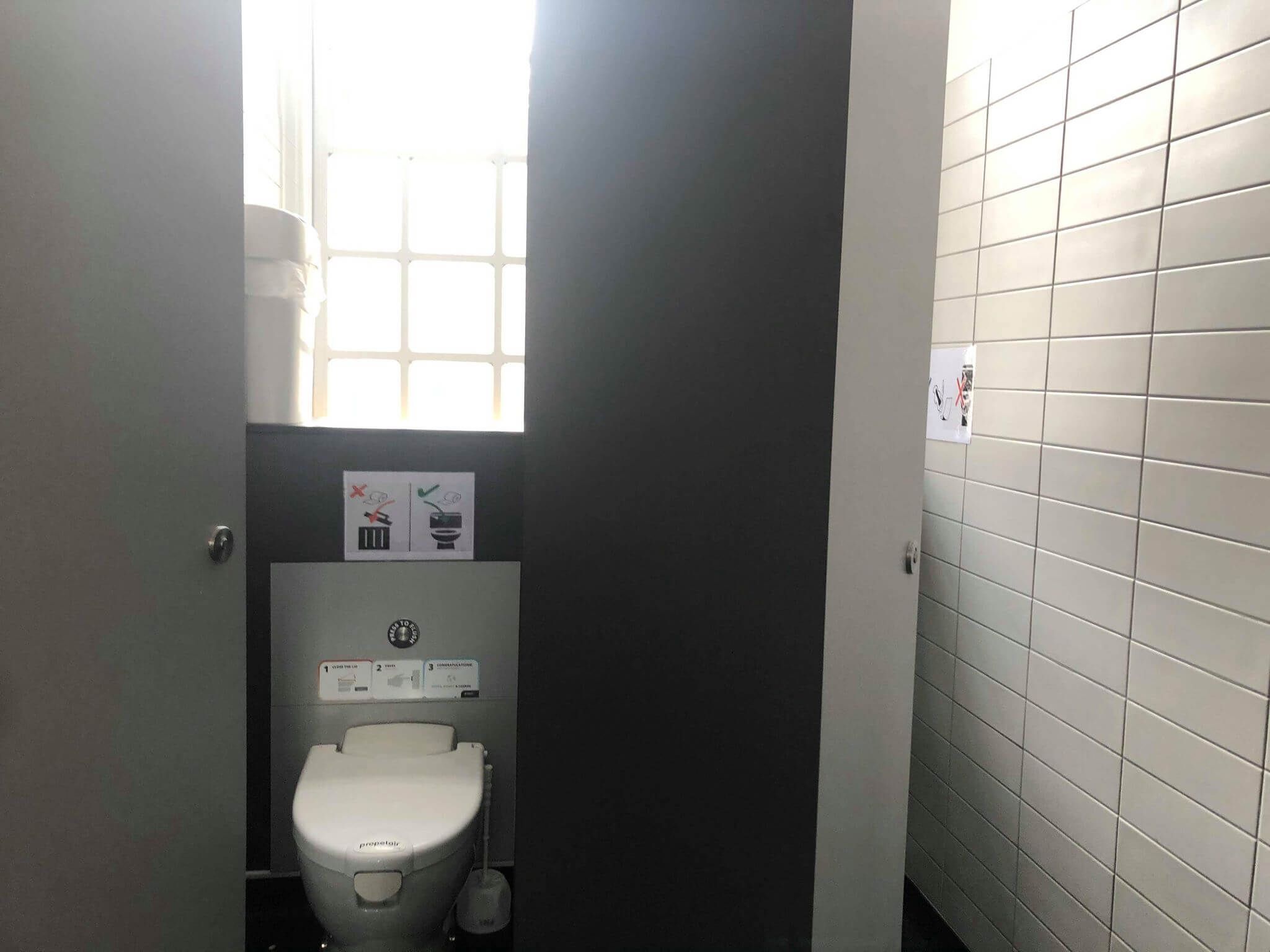 Image may contain: Corner, Interior Design, Bathroom, Toilet, Room, Indoors