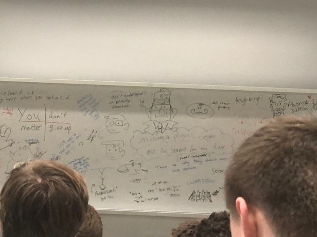 Image may contain: Handwriting, White Board, Person, Human, Text