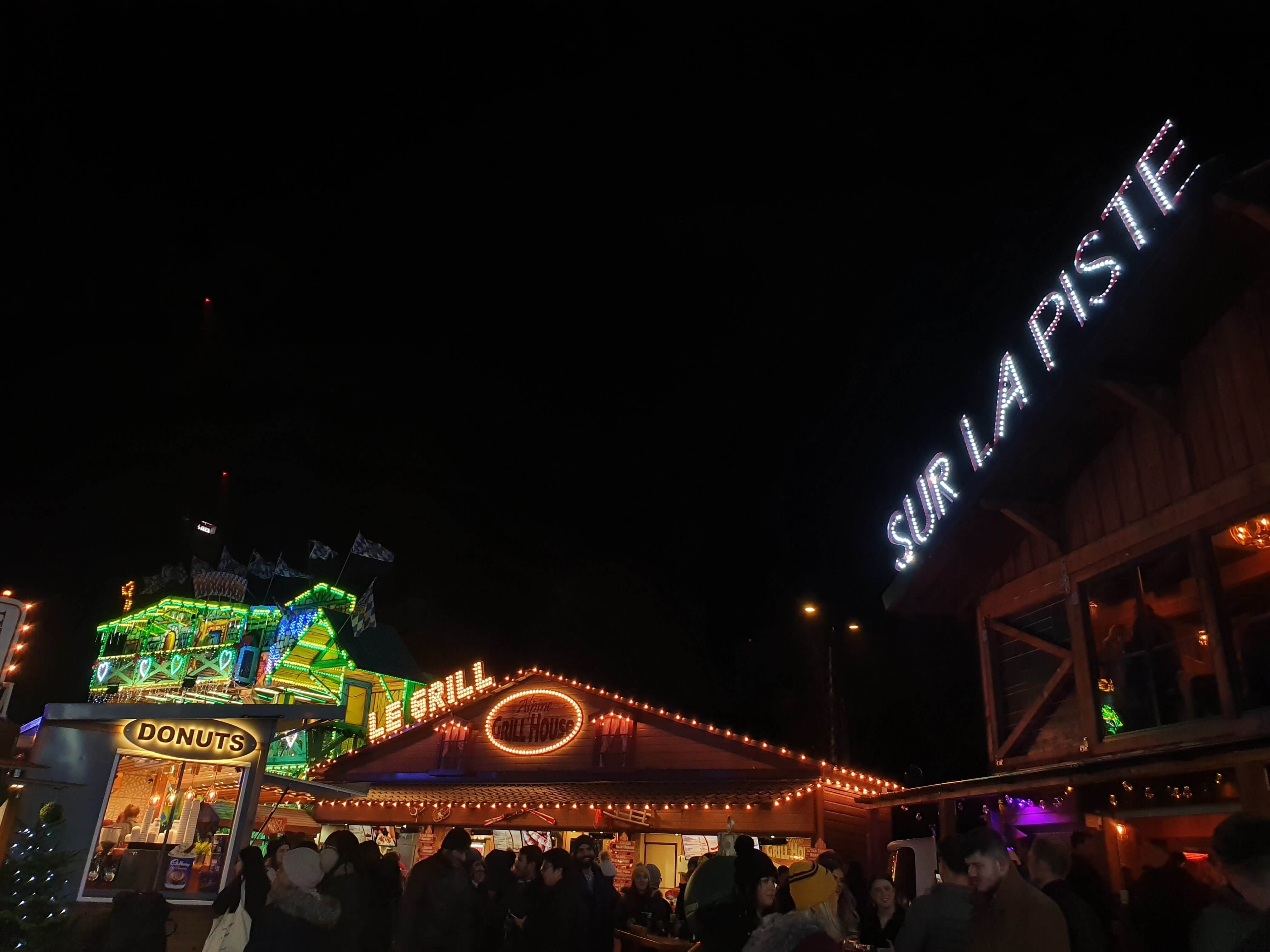 Image may contain: Lighting, Crowd, Amusement Park, Theme Park, Human, Person