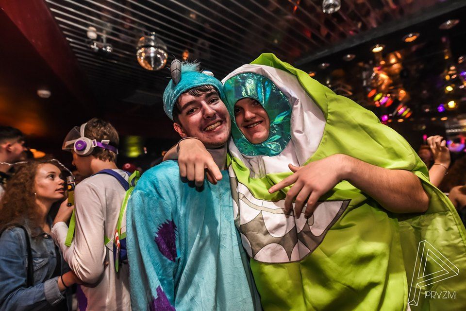 Image may contain: People, Photo, Portrait, Photography, Female, Dress, Party, Crowd, Glasses, Night Life, Coat, Head, Accessory, Sunglasses, Accessories, Face, Costume, Person, Human, Apparel, Clothing