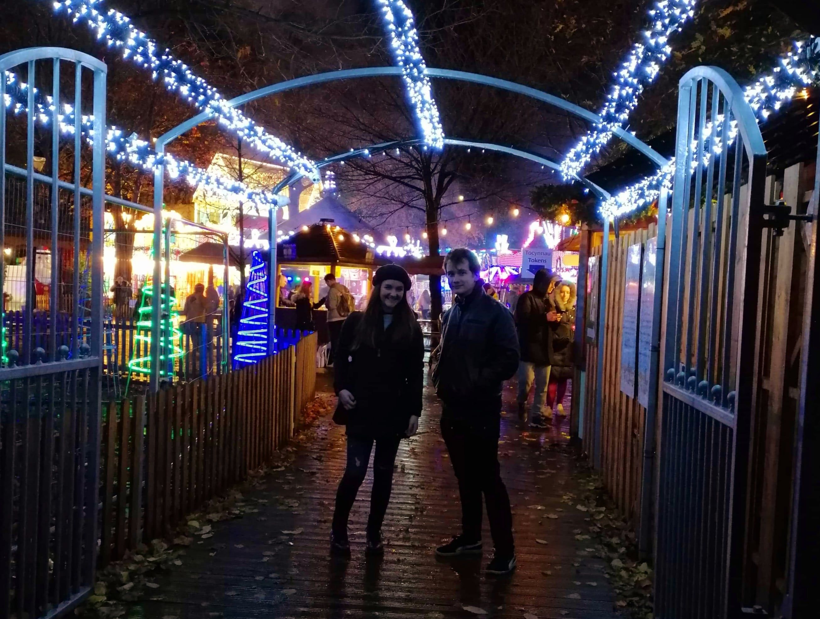 Image may contain: Lighting, Apparel, Shoe, Clothing, Footwear, Amusement Park, Theme Park, Sidewalk, Pavement, Path, Human, Person