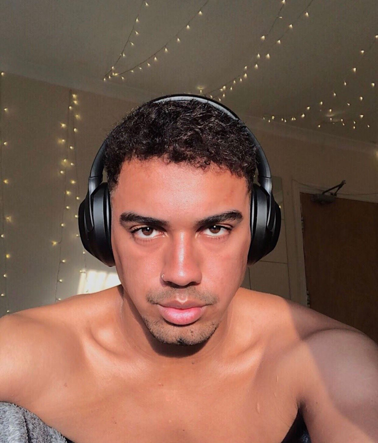 Image may contain: Face, Home Decor, Headset, Headphones, Electronics, Person, Human