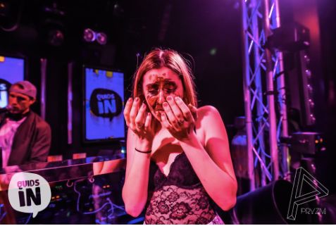 Image may contain: Night Club, Purple, Face, Night Life, Club, Dj, Human, Person, Lighting