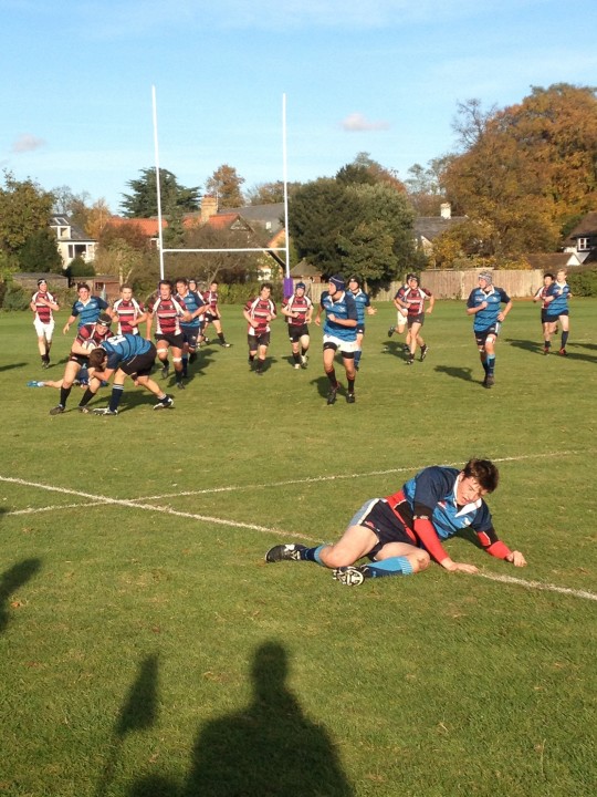 A weakened Pembroke player recovers from the heroic effort. This is not me.