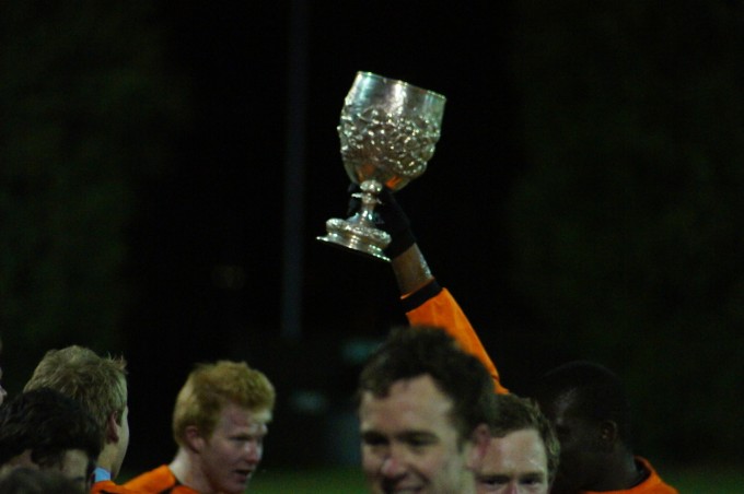 Man of the Match Simba Mutasa holds the Cuppers trophy aloft