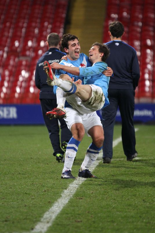 Last year's captain Broadway cradling Varsity hero Rich Totten