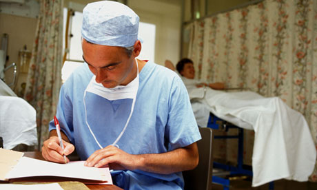 Surgeon writing notes