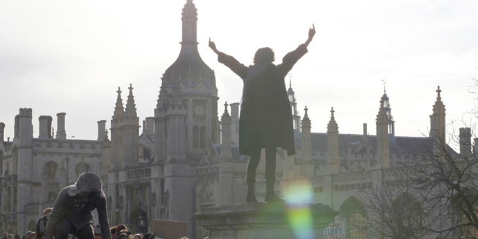 A demonstrator gestures as students occupy the grounds of Senate House at Cambridge University, in Cambridge