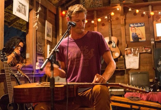 Warren performing on his travels through Asia.