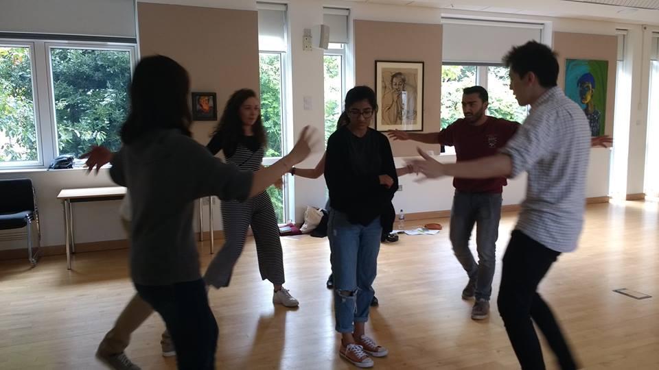 The cast rehearse a scene of entrapment. Photo credit: Sneha Lala