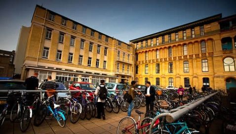 Image may contain: Urban, Town Square, Town, Plaza, Downtown, City, Building, Architecture, Motorcycle, Person, People, Human, Vehicle, Transportation, Bike, Bicycle