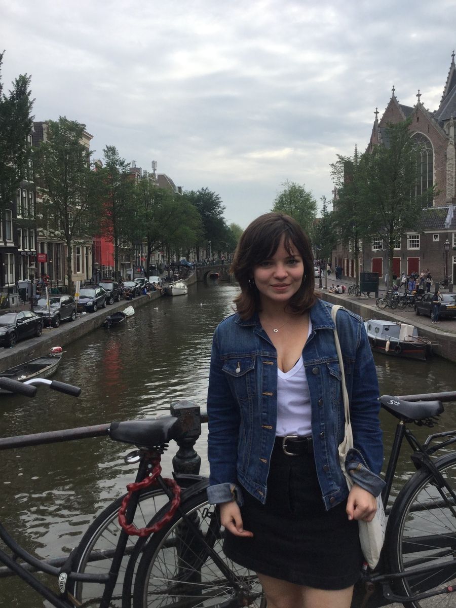 Image may contain: Water, River, Outdoors, Canal, Skirt, Miniskirt, Clothing, Vehicle, Bike, Bicycle, Human, Person, People