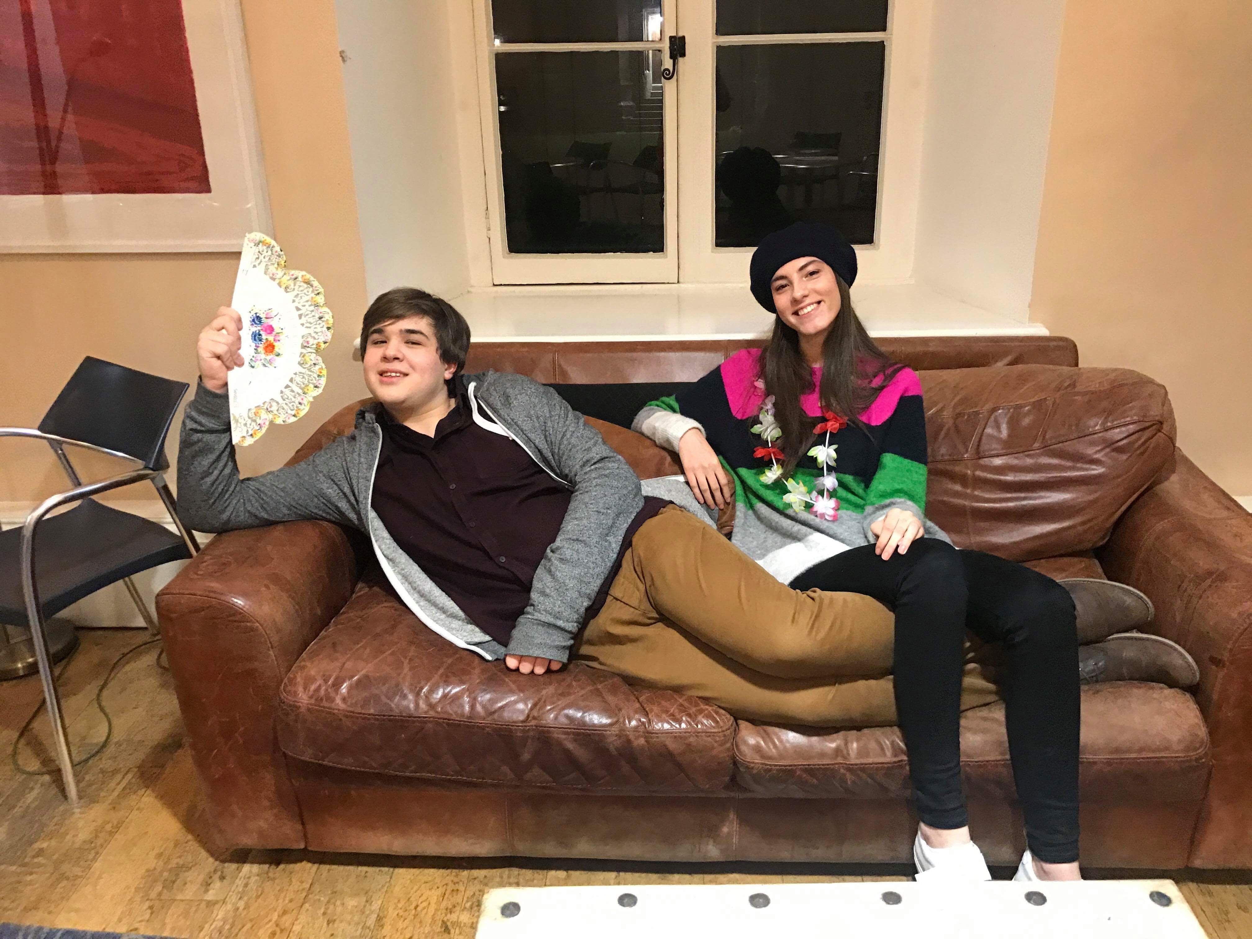Image may contain: Smile, Portrait, Face, Chair, Person, People, Human, Furniture, Couch
