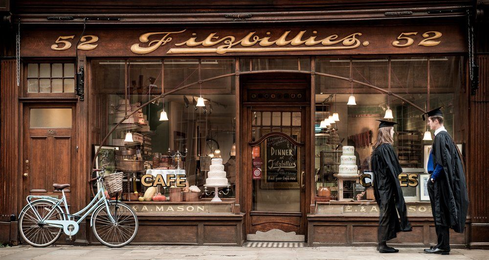 Image may contain: Window Display, Leather Jacket, Jacket, Coat, Clothing, Shop, Restaurant, Cafe, Vehicle, Transportation, Bike, Bicycle, Person, People, Human
