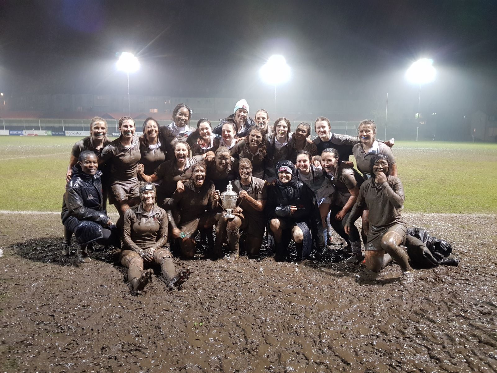 Image may contain: Team, Person, People, Human, Soil, Mud