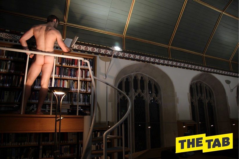 Image may contain: Bookcase, Room, Handrail, Banister, Indoors, Furniture, Human, Person