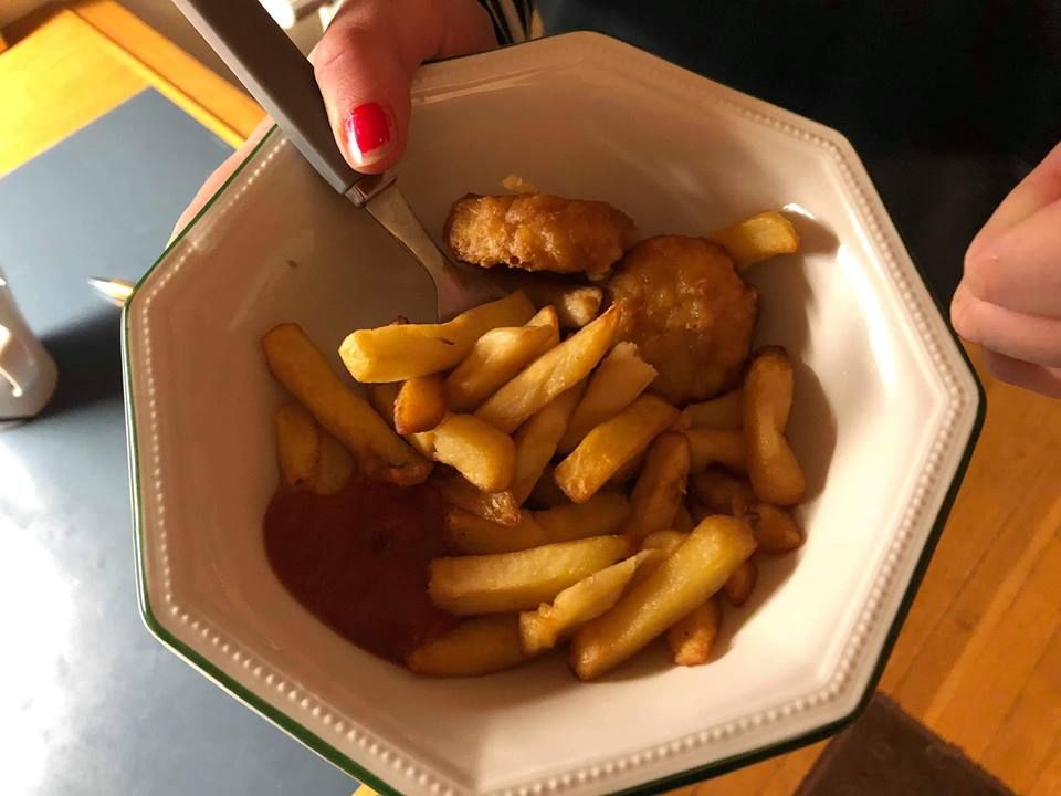 Image may contain: Fried Chicken, Fries, Food, Person, Human