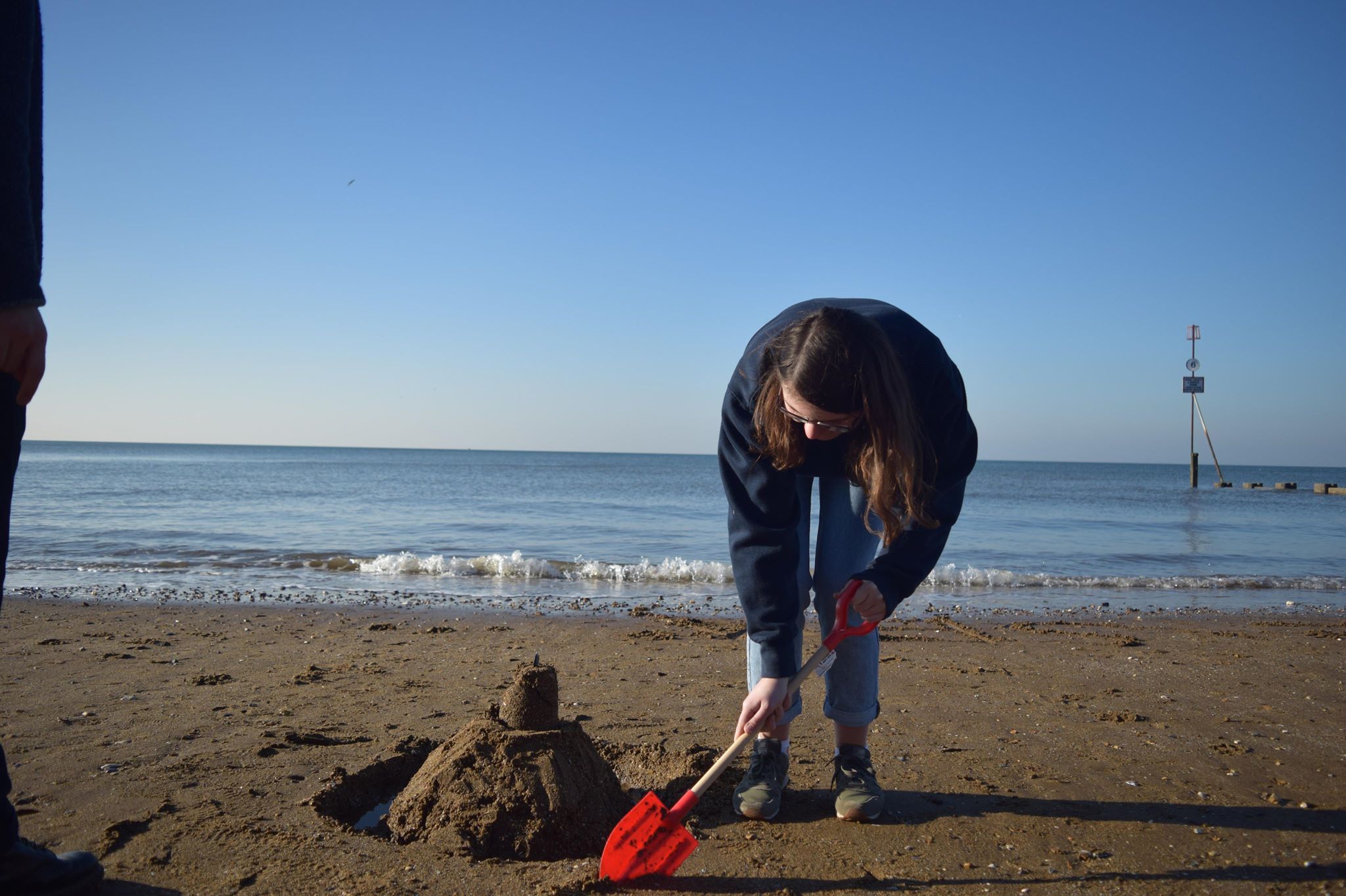 Image may contain: Tool, Sand, Outdoors, Nature, Human, Person