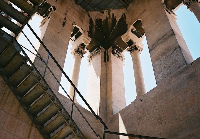 Image may contain: Pillar, Column, Architecture, Building, Cross, Symbol, Staircase, Banister, Handrail