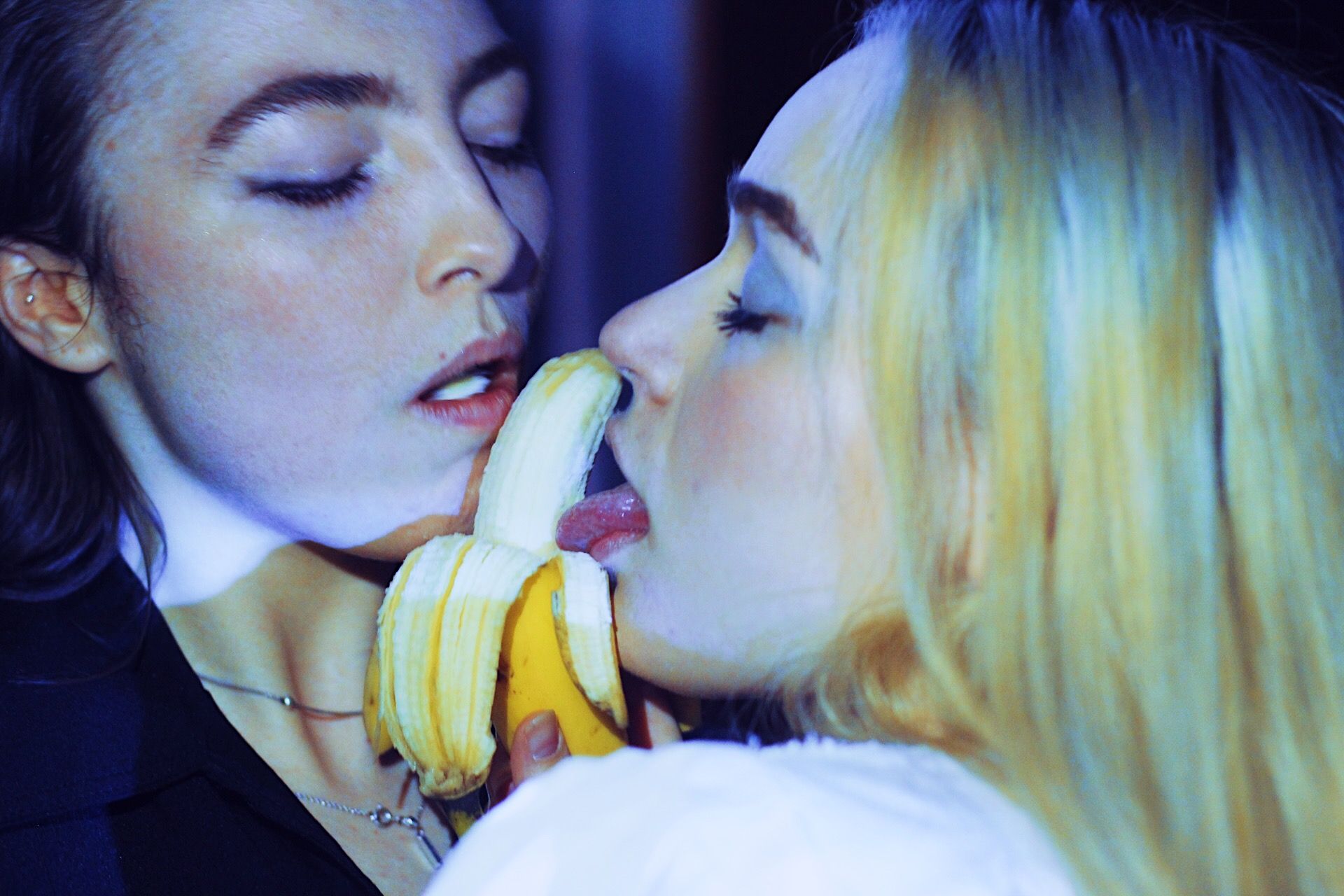 Image may contain: Eating, Finger, Fruit, Food, Banana, Plant, Person, Human