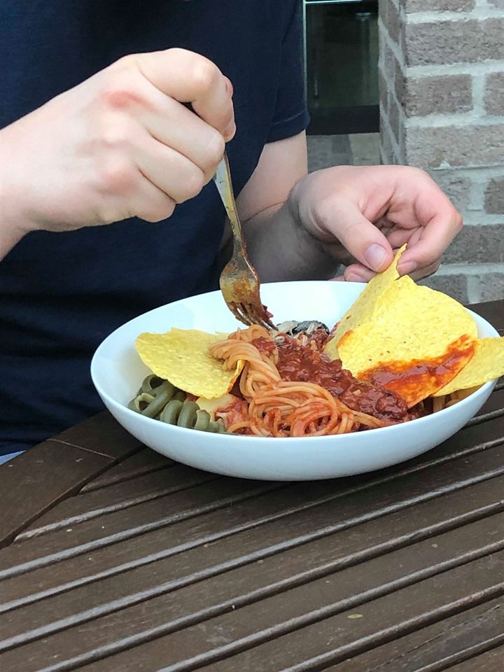 Image may contain: Pasta, Sandwich, Food, Human, Person