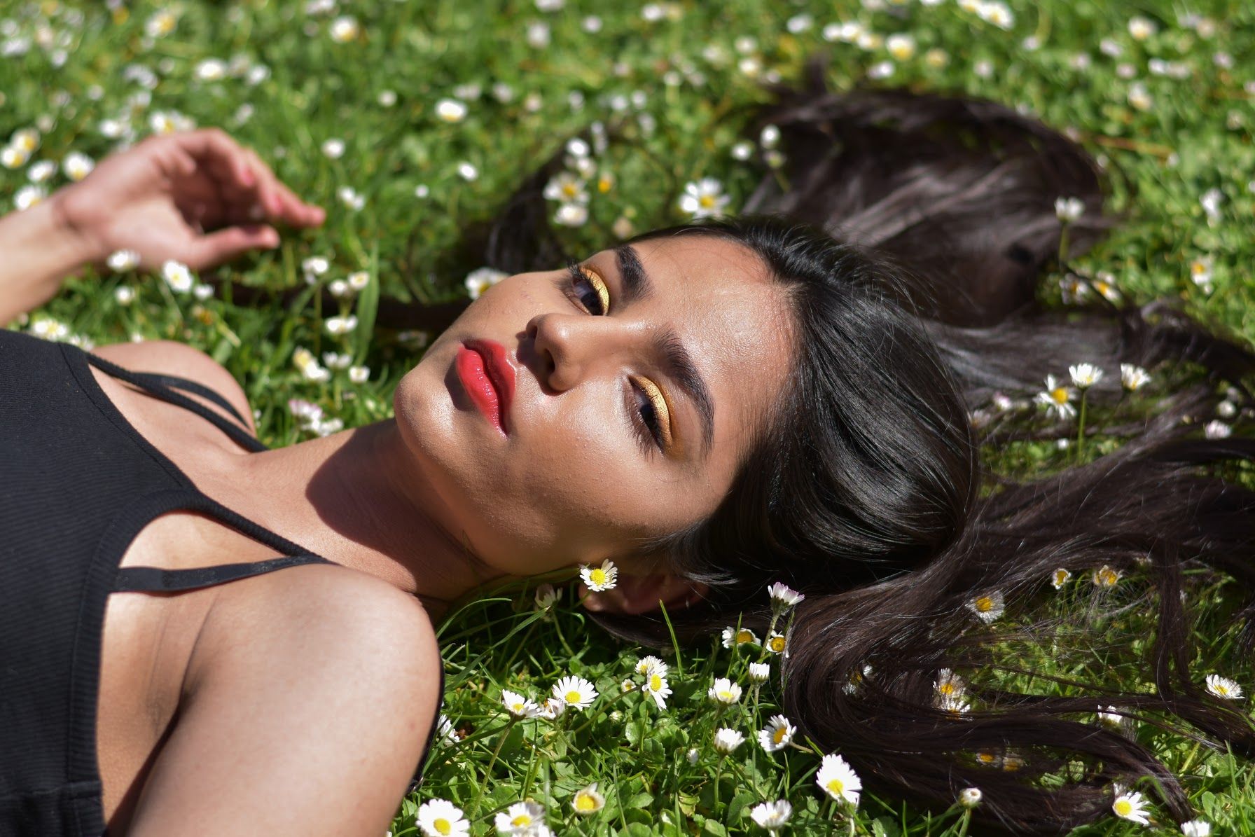 Image may contain: Petal, Female, Clothing, Apparel, Blossom, Flower, Grass, Person, Human, Plant