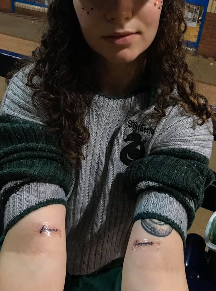 Image may contain: Female, Sweater, Wrist, Hand, Human, Face, Person, Clothing, Apparel, Skin