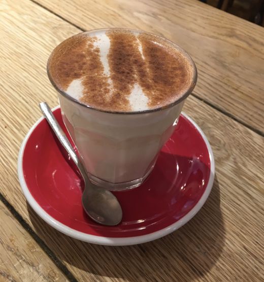 Image may contain: Wood, Furniture, Table, Latte, Drink, Coffee Cup, Beverage, Cup, Pottery, Saucer, Spoon, Cutlery