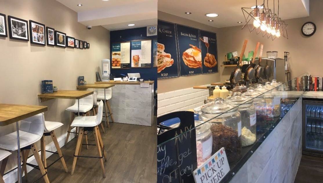 Image may contain: Cafe, Architecture, Tower, Building, Clock Tower, Shop, Bakery, Chair, Furniture, Meal, Food, Cafeteria, Restaurant