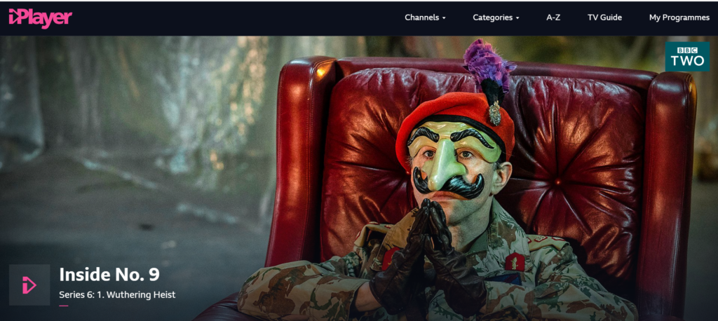 A screenshot from the BBC iPlayer webpage for Inside No. 9, depicting a man in a military uniform and theatrical mask
