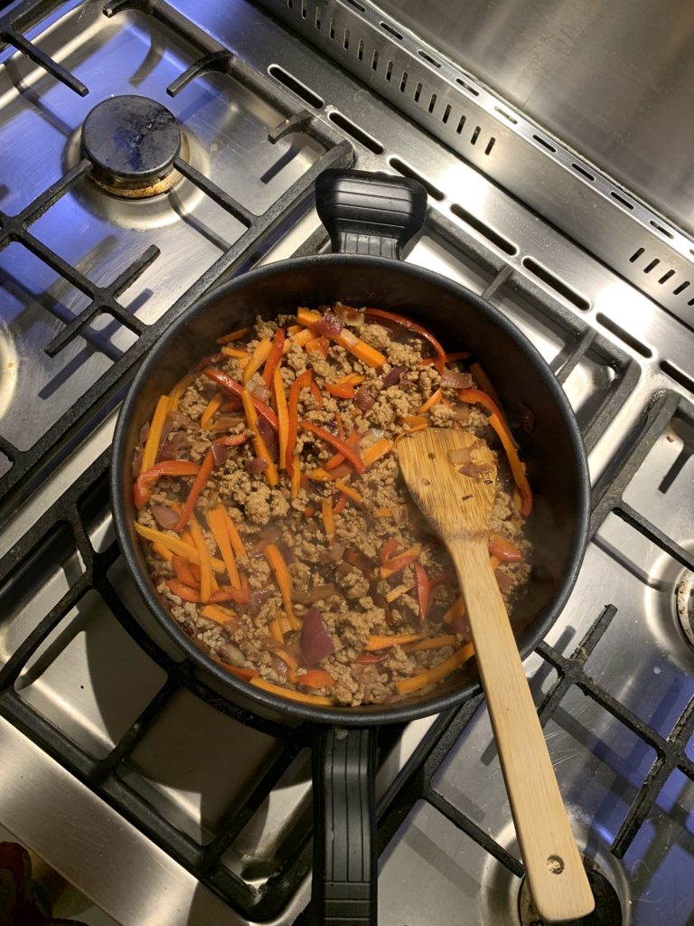 Carrots, mince, onions and pepper frying