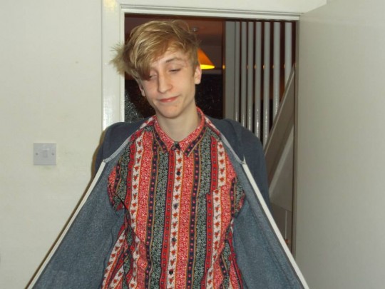 Opens his hoodie and BAM