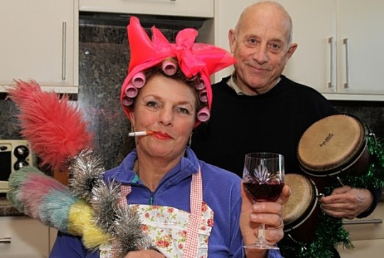 Mr and Mrs Bloom in their 2013 Christmas card photo - him with 'Bongo Bongo drums', her dressed as a 'slut'