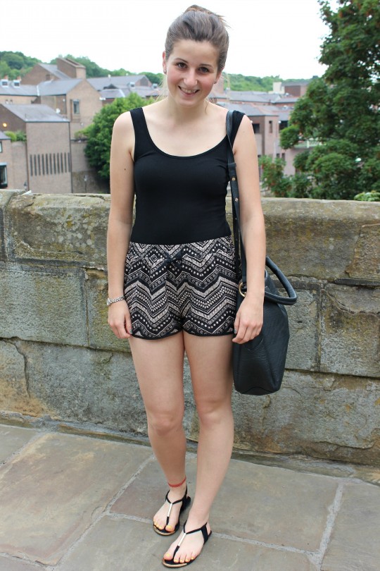 Vicki rocks coordinated-chic in statement black and gold shorts.