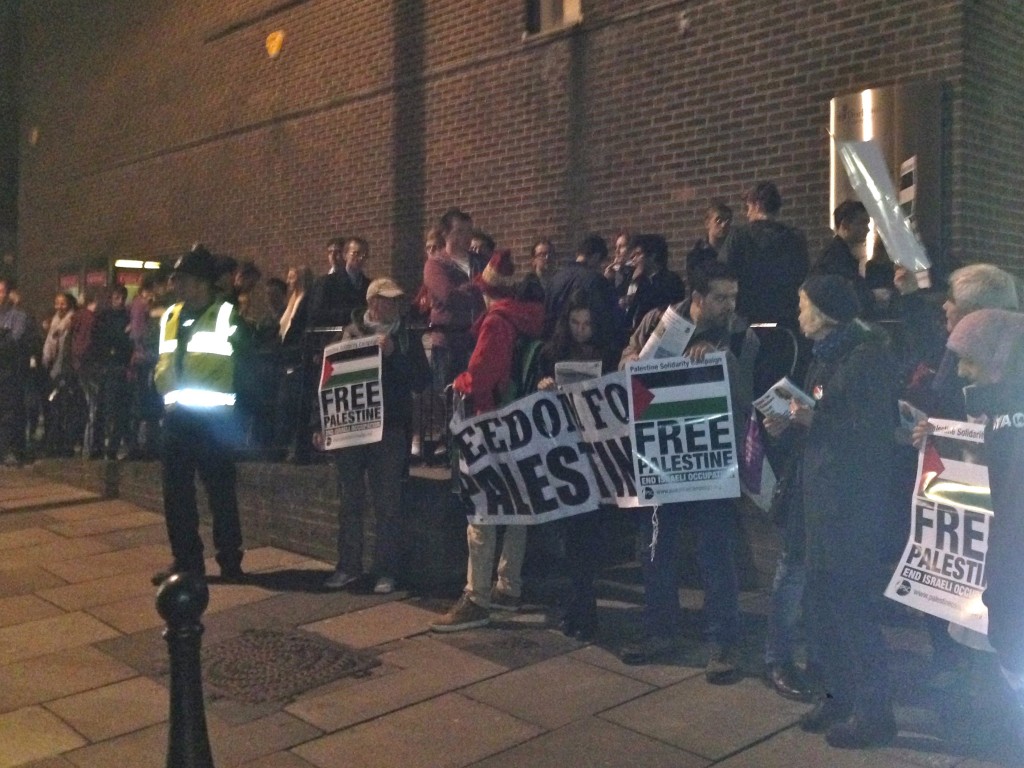 Students dwarfed the silent vigil in front of them