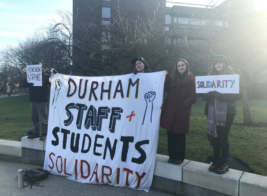 Image may contain: Crowd, Text, Banner, Person, People, Human