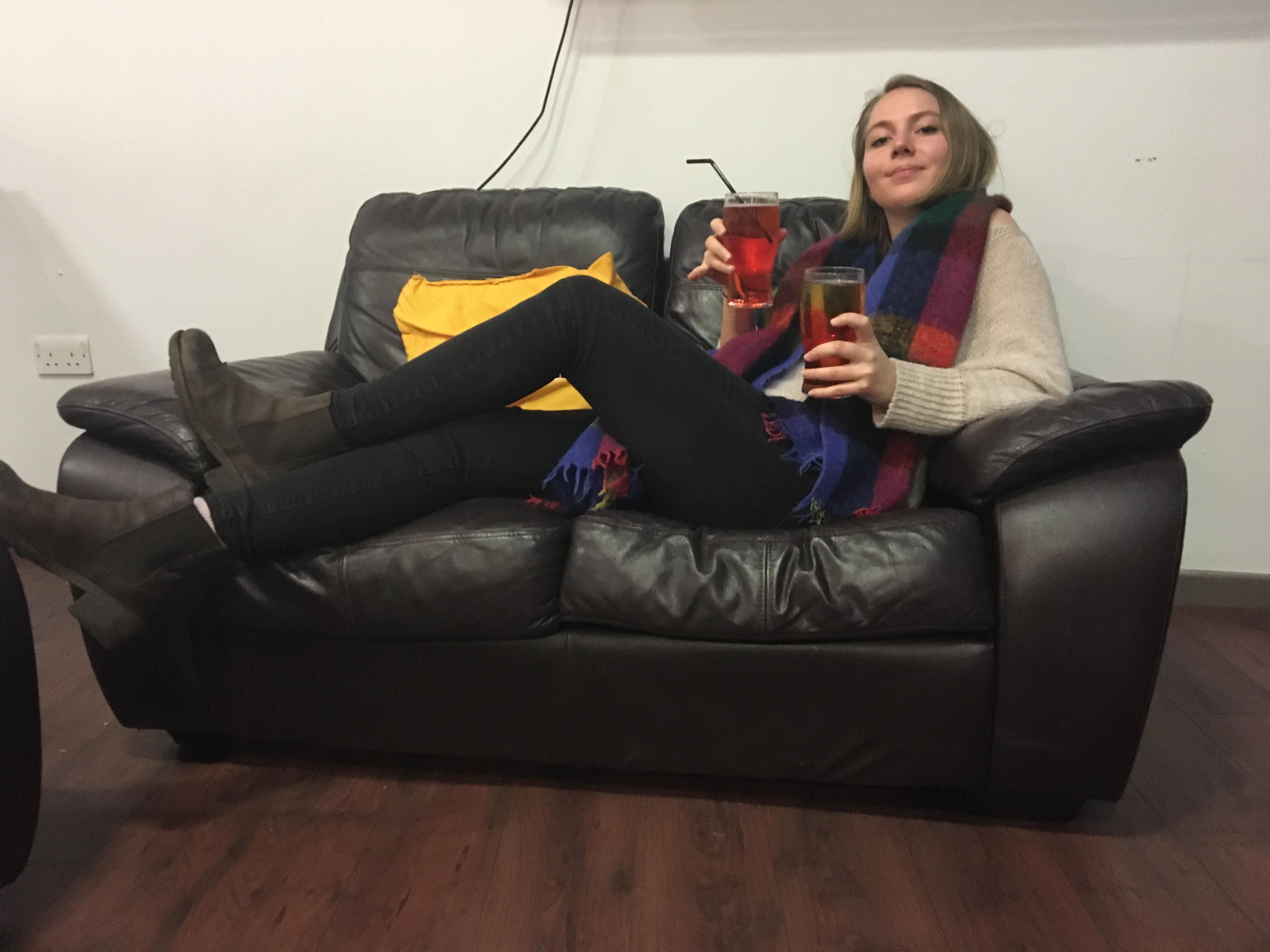 Image may contain: Person, People, Human, Furniture, Couch