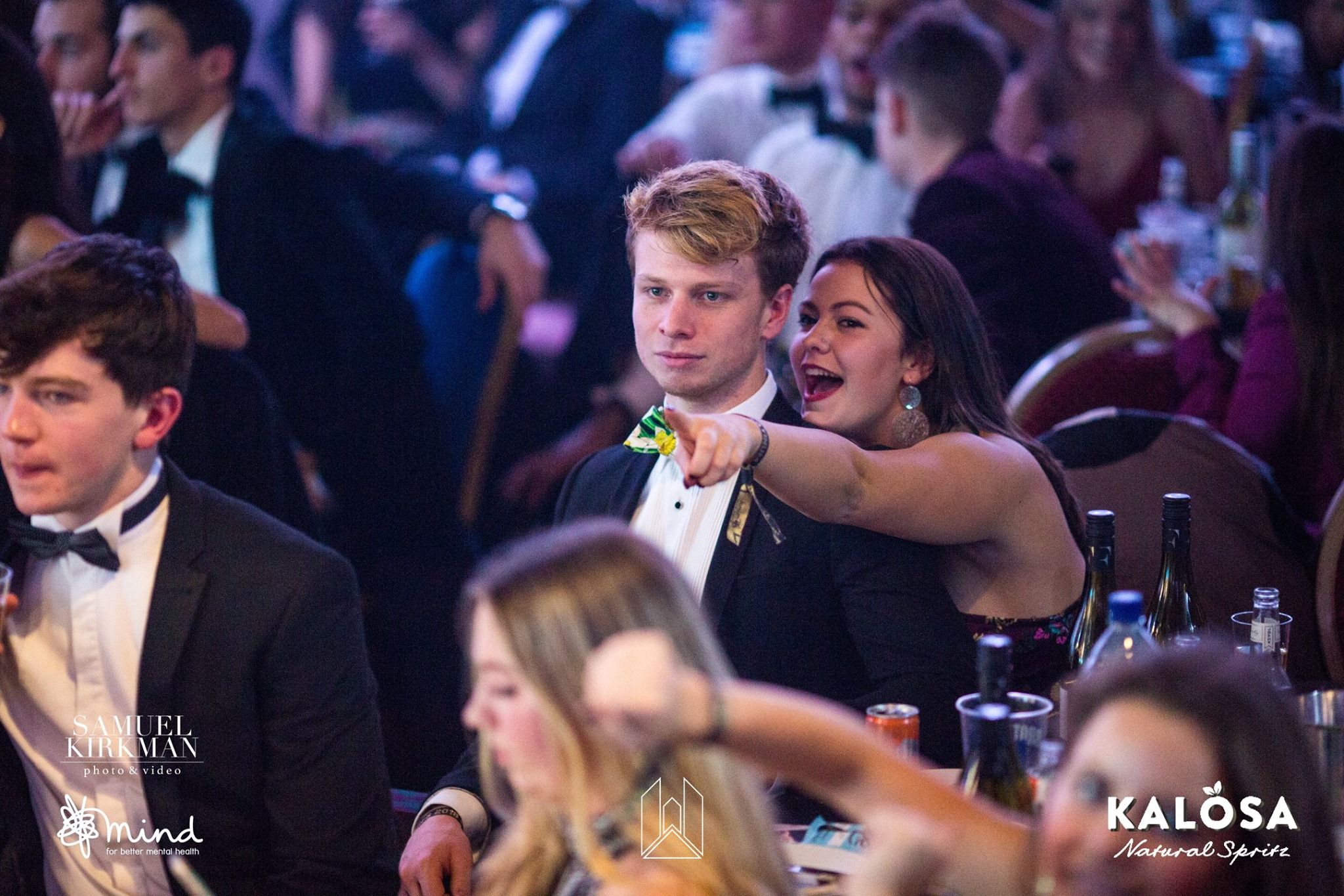 Image may contain: Night Life, Party, Night Club, Coat, Suit, Overcoat, Clothing, Apparel, Club, Bar Counter, Audience, Crowd, Pub, Person, Human